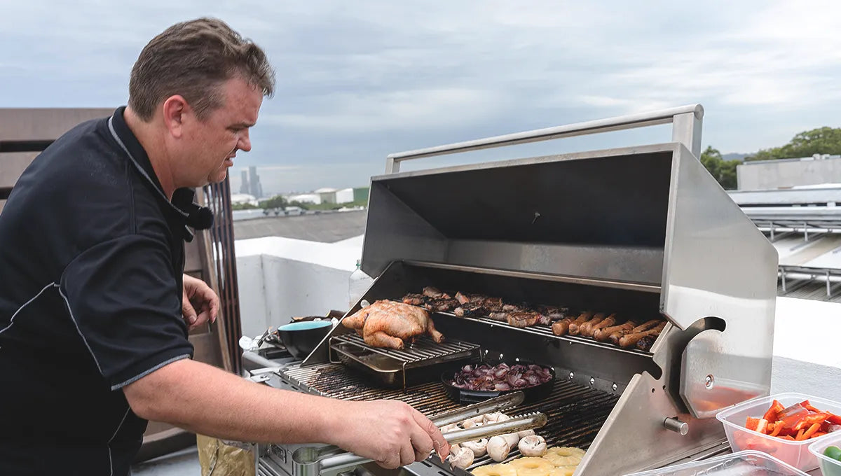 Tucker Charcoal Deluxe Pro BBQ on Cabinet with Roasting Hood