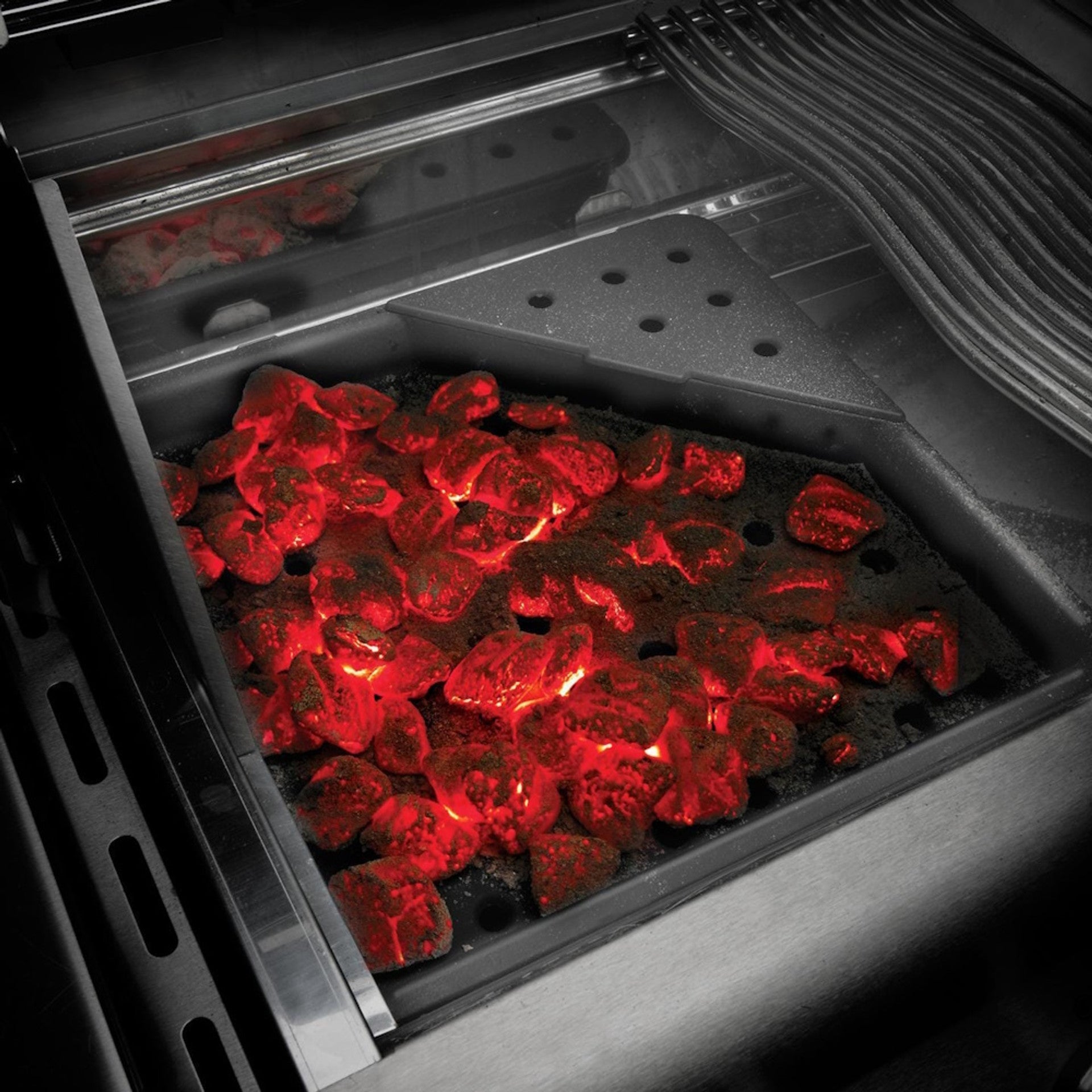 Want the charcoal flavour on a gas BBQ? Hybrid BBQs