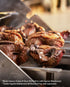 Close-up of browned picanha beef on stainless steel skewers fitted to a Tucker R Class Cypriot attachment