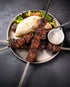 Greek beef rump souvlaki skewers served with pita bread, mixed salad and a creamy dipping sauce